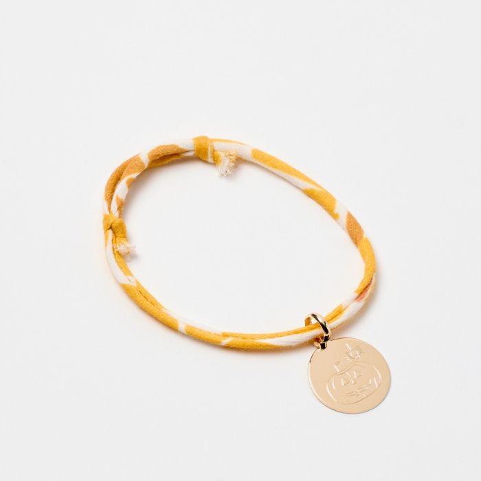 Bracelet petite médaille plate plaqué or sur cordon liberty