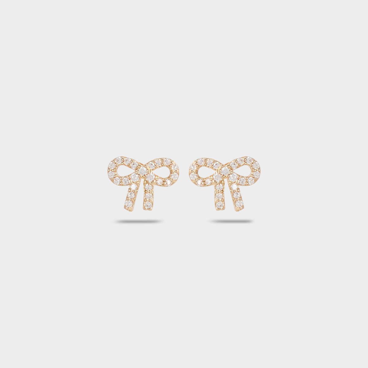 Boucles d'oreilles noeud pavé plaqué or