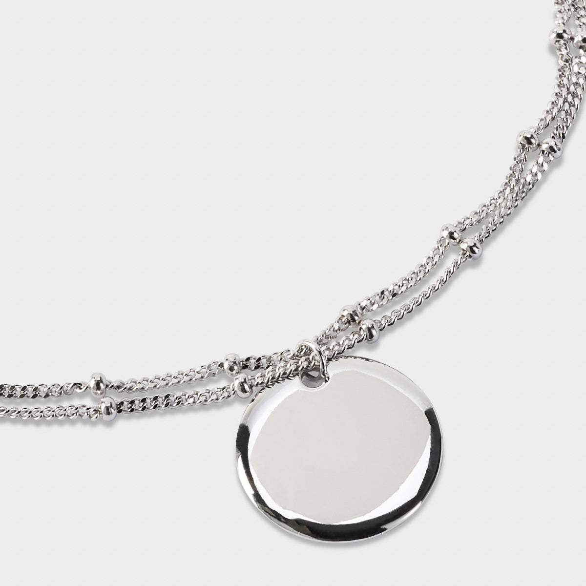 Bracelet breloque sur double chaîne perlée argent