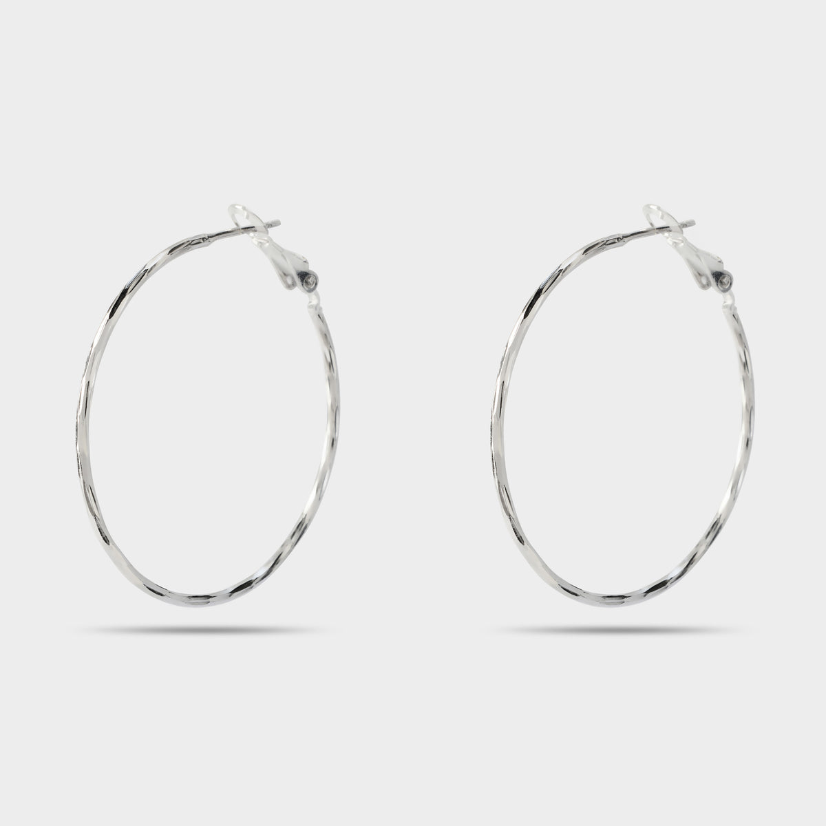 Boucles d'oreilles grandes créoles torsadées argent
