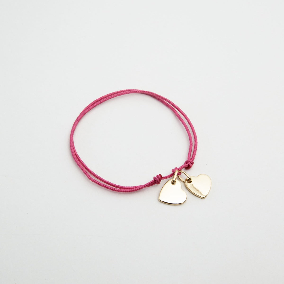 Bracelet 2 mini breloques liées plaqué or