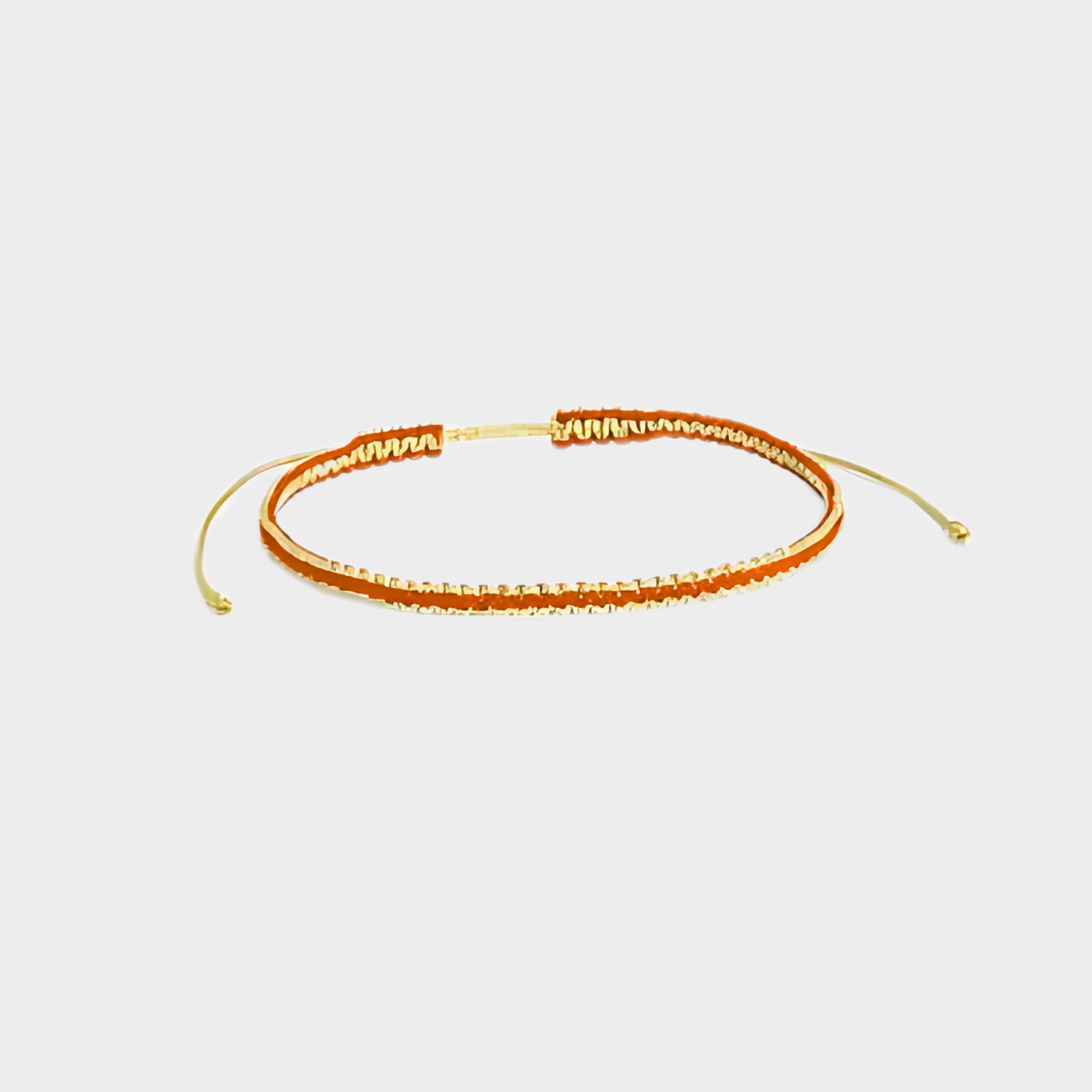 Bracelet tissé pailleté fil or et orange